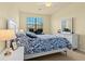 Bright bedroom with a queen-size bed and workspace at 6406 Grand Estuary Trl # 102, Bradenton, FL 34212