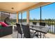 Screened lanai with outdoor furniture and pond view at 6406 Grand Estuary Trl # 102, Bradenton, FL 34212