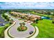 Community overview with a pond and homes at 6406 Grand Estuary Trl # 102, Bradenton, FL 34212