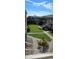 Exterior view of an apartment building with a grassy courtyard and walkways at 400 Base E Ave # 229, Venice, FL 34285