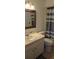 Clean bathroom with shower/tub combo, toilet, vanity, and mirror at 400 Base E Ave # 229, Venice, FL 34285