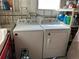 Bright laundry room with a Whirlpool washer and dryer at 4775 Tri Par Dr, Sarasota, FL 34234