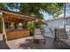 Backyard featuring a hot tub under a covered area and lounge chairs on a wood deck, perfect for relaxation at 1332 3Rd W Ave, Bradenton, FL 34205