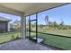 Relaxing screened lanai with beautiful stone pavers offering serene outdoor living space with views of the backyard at 18773 Dayspring Pl, Venice, FL 34293