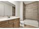 Clean bathroom with bathtub, single vanity, and tile flooring at 18876 Daybreak Dr, Venice, FL 34293