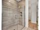 Large walk-in shower with glass enclosure and modern tile at 18876 Daybreak Dr, Venice, FL 34293