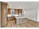 Modern kitchen with an island and hardwood floors at 18876 Daybreak Dr, Venice, FL 34293