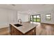 Modern kitchen with island and access to backyard at 18876 Daybreak Dr, Venice, FL 34293