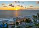 Aerial view of beachfront property at sunset at 1900 Gulf N Dr # 1, Bradenton Beach, FL 34217