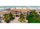 Aerial view of beach house at sunset, showcasing ocean views at 1900 Gulf N Dr # 1, Bradenton Beach, FL 34217
