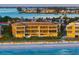 Aerial view of beachfront condo building with stunning ocean views at sunset at 1900 Gulf N Dr # 1, Bradenton Beach, FL 34217
