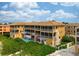 Beachfront building with pool and lush landscaping at 1900 Gulf N Dr # 1, Bradenton Beach, FL 34217