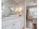 Bathroom with single vanity and access to a bedroom at 1900 Gulf N Dr # 1, Bradenton Beach, FL 34217