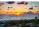 Couple watching sunset over the ocean at 1900 Gulf N Dr # 1, Bradenton Beach, FL 34217