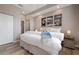 Bedroom featuring hardwood style floors, neutral decor, and ensuite bathroom at 1900 Gulf N Dr # 1, Bradenton Beach, FL 34217