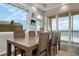 Dining room with ocean views and large table, perfect for entertaining at 1900 Gulf N Dr # 1, Bradenton Beach, FL 34217