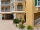 Close-up of building exterior, showing architectural details and fountain at 1900 Gulf N Dr # 1, Bradenton Beach, FL 34217