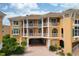 Beachfront building exterior, featuring balconies and a courtyard at 1900 Gulf N Dr # 1, Bradenton Beach, FL 34217