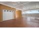 A well-lit, spacious garage with an automatic door, and easy access to the outdoors at 1900 Gulf N Dr # 1, Bradenton Beach, FL 34217