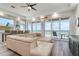 Open-concept living room with modern decor, ocean view, and hardwood style flooring at 1900 Gulf N Dr # 1, Bradenton Beach, FL 34217