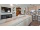 Open concept living area with sleek decor, ocean view, and convenient kitchen access at 1900 Gulf N Dr # 1, Bradenton Beach, FL 34217