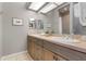 Beautiful bathroom featuring double sinks, quartz countertops, and decorative accents at 1900 Gulf N Dr # 1, Bradenton Beach, FL 34217