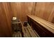 Clean sauna with wooden benches and bucket at 2564 Clubhouse Cir # 204, Sarasota, FL 34232