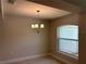 A cozy bedroom with a chandelier and a nice window with a view of the outdoors at 5018 Wagon Wheel Dr, North Port, FL 34291