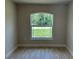 A bedroom with a view of the outdoors through a window at 5018 Wagon Wheel Dr, North Port, FL 34291