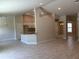 Open-concept living space with tile floors, recessed lighting, and a seamless flow into the kitchen and dining areas at 5018 Wagon Wheel Dr, North Port, FL 34291