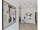 Bright foyer features neutral walls with tile flooring and striking decorative accents at 7390 Divot Loop, Lakewood Ranch, FL 34202