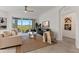 Comfortable living room with plush seating, neutral tones, and scenic view at 7390 Divot Loop, Lakewood Ranch, FL 34202