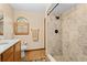 Updated bathroom boasting a tiled shower and a window for natural light at 7607 9Th Avenue Nw Dr, Bradenton, FL 34209