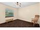Bedroom featuring carpet, ceiling fan, and a window for natural light at 7607 9Th Avenue Nw Dr, Bradenton, FL 34209