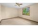 Bedroom featuring carpet, ceiling fan, and a window providing plenty of natural light at 7607 9Th Avenue Nw Dr, Bradenton, FL 34209