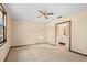 An empty bedroom featuring carpet, a ceiling fan, and a window for natural light at 7607 9Th Avenue Nw Dr, Bradenton, FL 34209