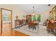 Well-lit dining room with hardwood floors and tiled flooring featuring a traditional dining table at 7607 9Th Avenue Nw Dr, Bradenton, FL 34209