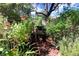 Garden filled with flower pots, benches and lush greenery at 7607 9Th Avenue Nw Dr, Bradenton, FL 34209
