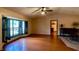 Spacious living room featuring hardwood floors and a ceiling fan at 7607 9Th Avenue Nw Dr, Bradenton, FL 34209