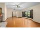 Bright living room featuring a vaulted ceiling, a ceiling fan, and a bay window with shutters at 7607 9Th Avenue Nw Dr, Bradenton, FL 34209