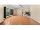 Spacious living room with hardwood floors, a large bay window, and vaulted ceiling at 7607 9Th Avenue Nw Dr, Bradenton, FL 34209