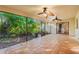 Relaxing covered patio featuring tile flooring, screened windows and access to the home's interior at 7607 9Th Avenue Nw Dr, Bradenton, FL 34209