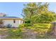 Spacious yard with mature trees, a tire swing, and lush greenery at 7607 9Th Avenue Nw Dr, Bradenton, FL 34209