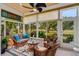 Relaxing sunroom overlooking a lush golf course view at 4652 Peridia E Blvd, Bradenton, FL 34203