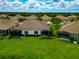 Back view of houses with screened patios at 11624 Okaloosa Dr, Venice, FL 34293