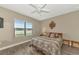 Cozy bedroom with a double bed and large window at 11624 Okaloosa Dr, Venice, FL 34293