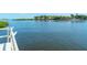 Scenic view of calm water with lush waterfront properties at 6157 Midnight Pass Rd # E12, Sarasota, FL 34242