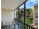 Private screened balcony overlooking courtyard at 6157 Midnight Pass Rd # E12, Sarasota, FL 34242