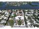 Aerial view of waterfront community, highlighting the building's location and surrounding area at 6157 Midnight Pass Rd # E12, Sarasota, FL 34242