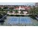 Aerial view of a tennis court within a community at 6157 Midnight Pass Rd # E12, Sarasota, FL 34242